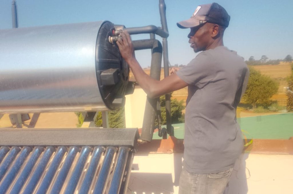 Technician installing a solar geyser in Randburg