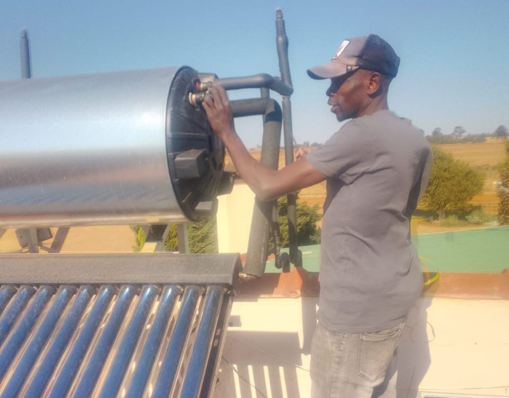 Technician installing a solar geyser in Randburg